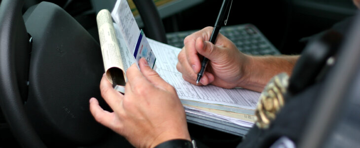 Police officer writing ticket