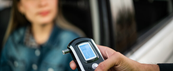 Close-up of traffic cop holding driving alcohol test