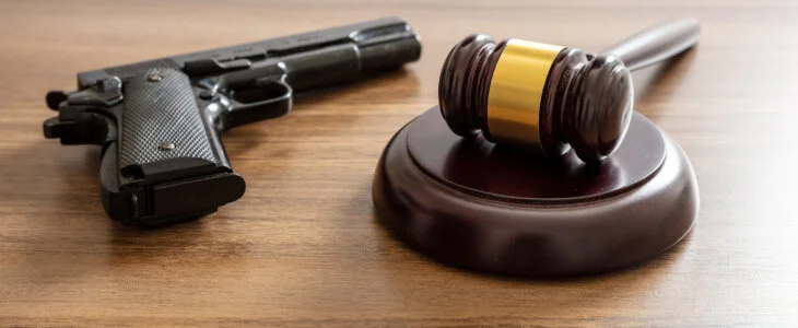 Gun and gavel on a table