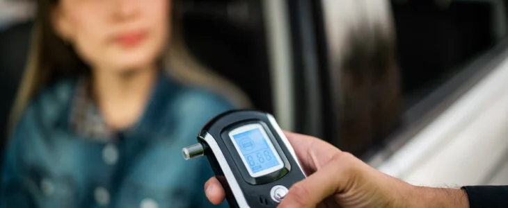Close-up of traffic cop holding driving alcohol test